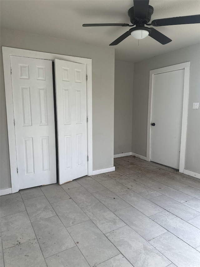 unfurnished bedroom featuring ceiling fan