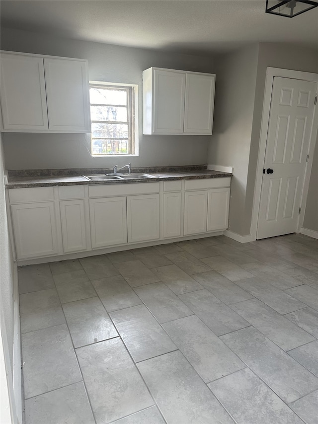 kitchen with white cabinets and sink