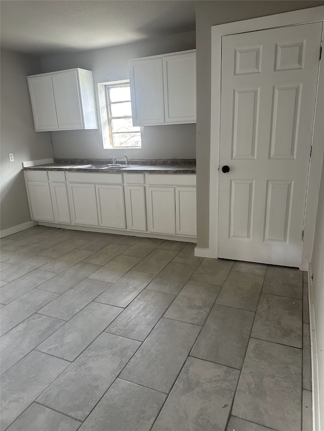 kitchen featuring white cabinetry