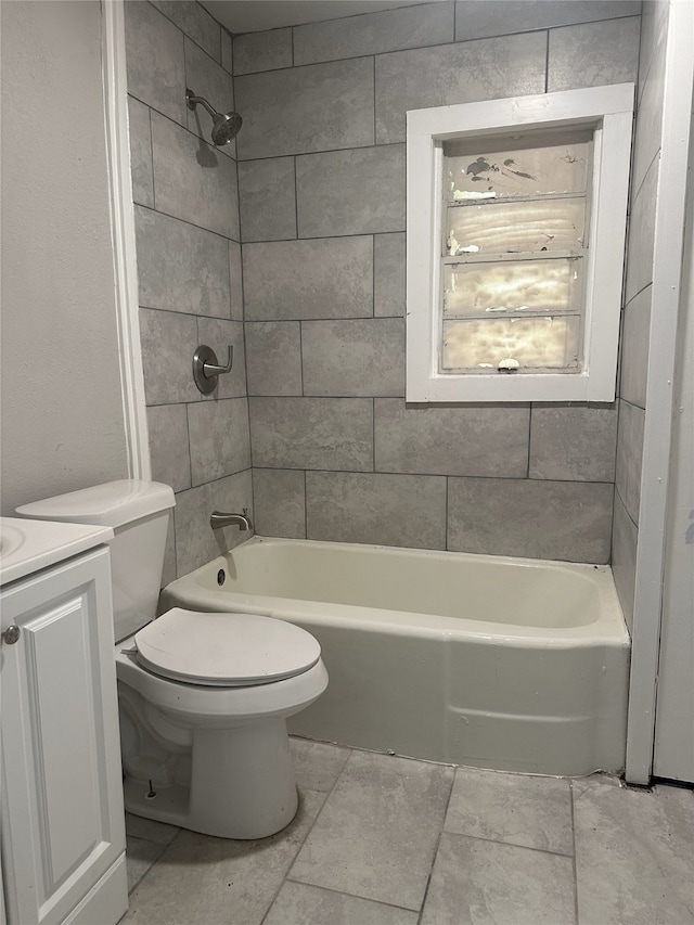 full bathroom featuring vanity, toilet, and tiled shower / bath