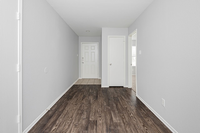 hallway featuring dark wood-type flooring