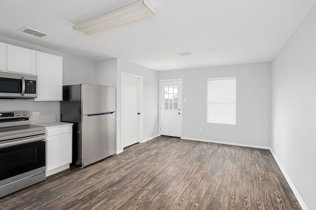 kitchen with white cabinetry, dark hardwood / wood-style flooring, and stainless steel appliances