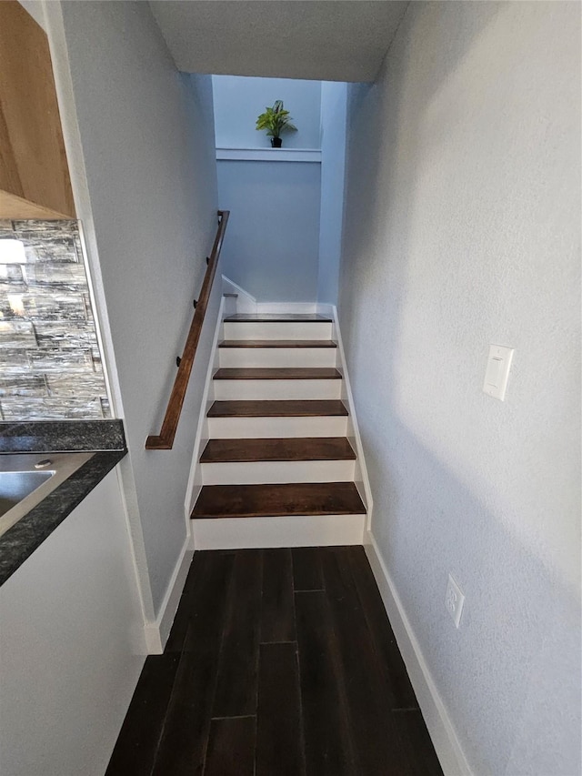 stairway featuring hardwood / wood-style floors