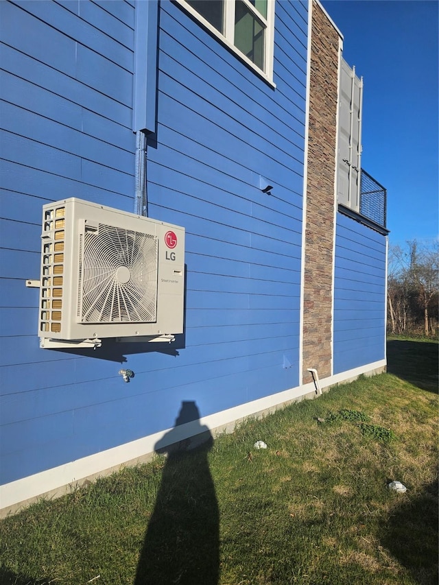 view of side of home featuring ac unit