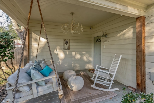 wooden terrace featuring covered porch