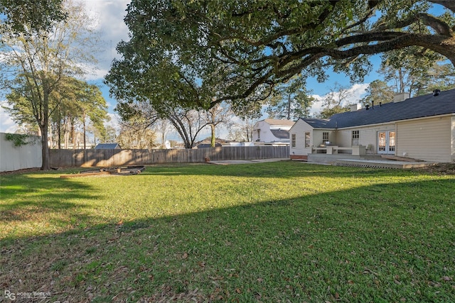 view of yard featuring french doors