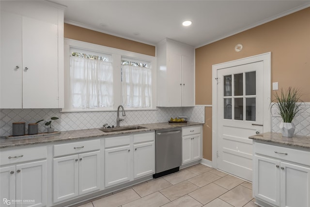 kitchen featuring white cabinetry, dishwasher, sink, light stone counters, and decorative backsplash