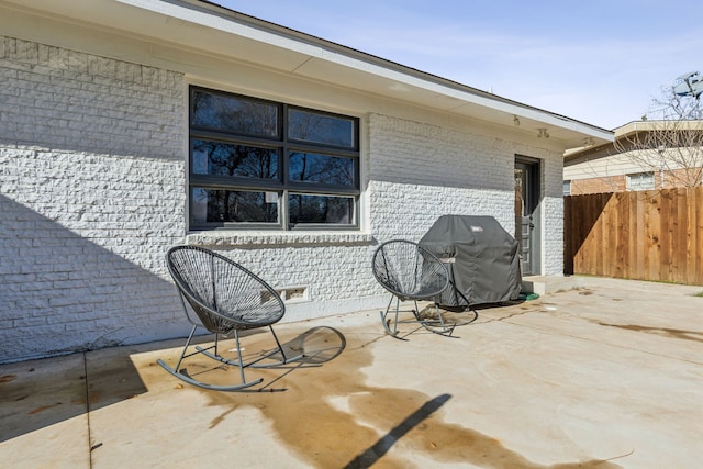 view of patio featuring a grill