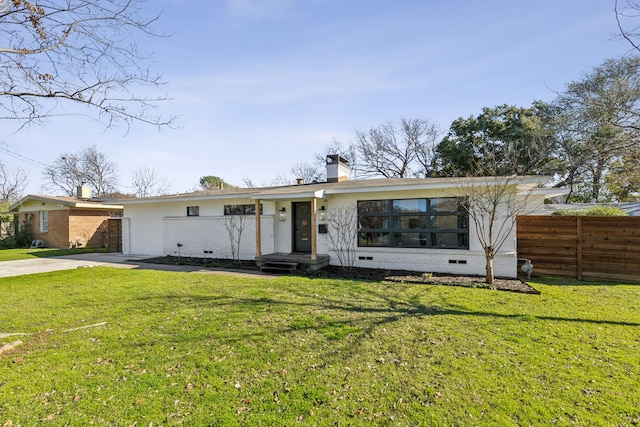 ranch-style home with a front yard