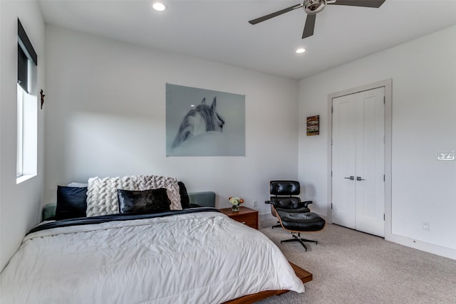 bedroom with carpet flooring, ceiling fan, and a closet