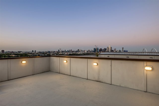 view of patio terrace at dusk