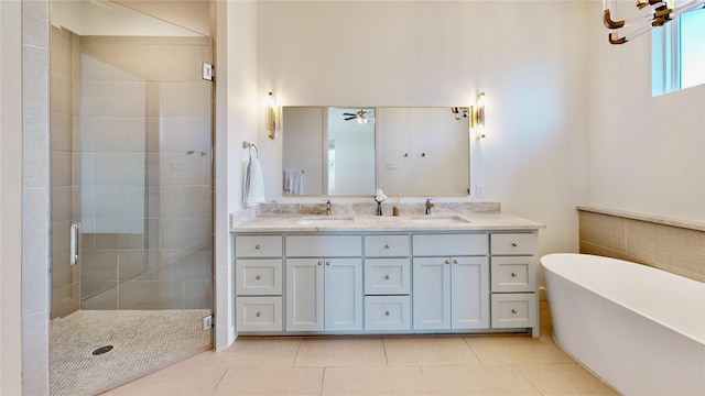 bathroom with vanity, tile patterned floors, plus walk in shower, and ceiling fan