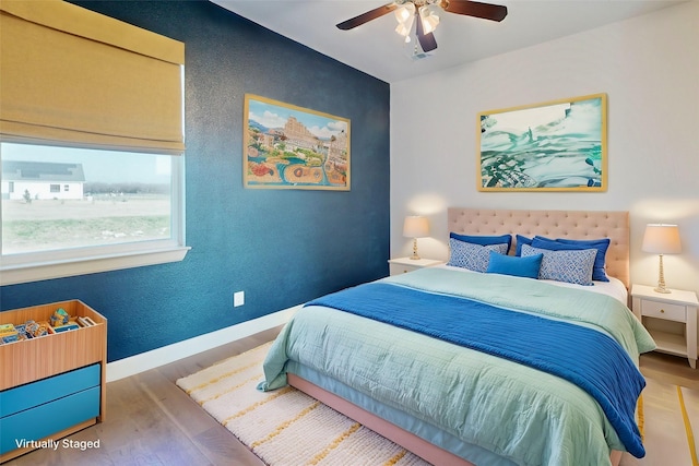 bedroom featuring wood-type flooring and ceiling fan