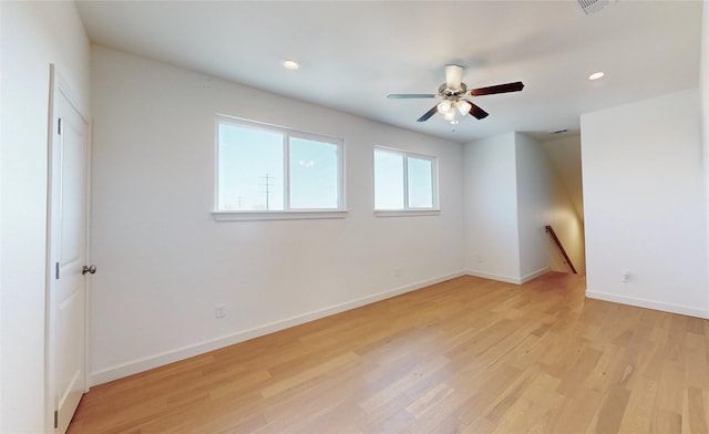 unfurnished room featuring light hardwood / wood-style floors and ceiling fan