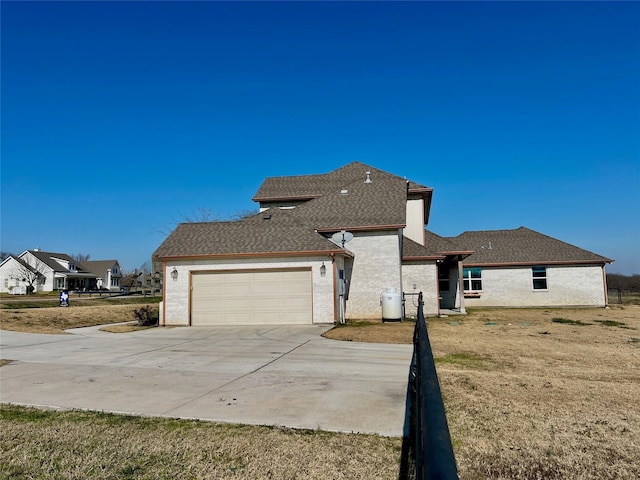 exterior space with a garage and a yard