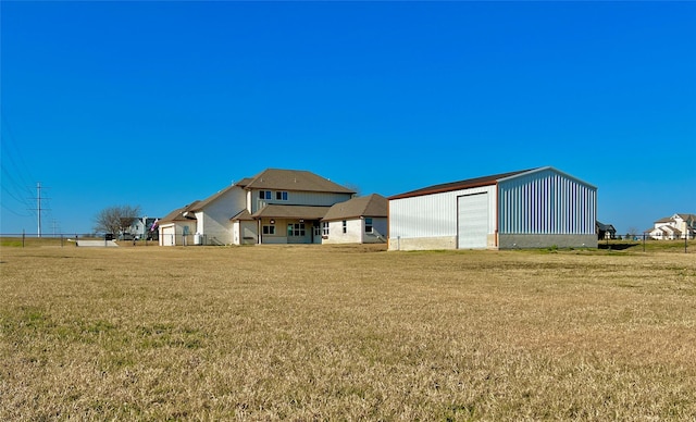 exterior space with an outbuilding and a garage