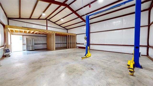 garage featuring stainless steel fridge