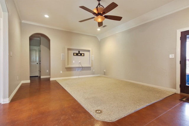 carpeted spare room with ornamental molding and ceiling fan