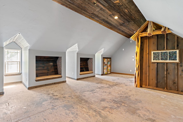 unfurnished living room featuring vaulted ceiling and wood ceiling