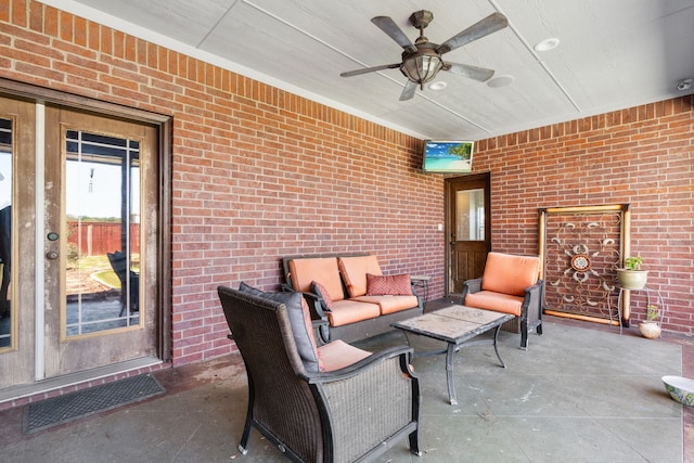 view of patio with ceiling fan and an outdoor hangout area