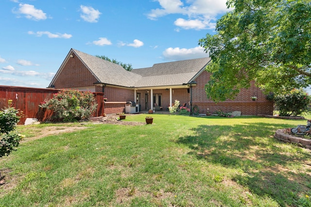 ranch-style home with a front lawn