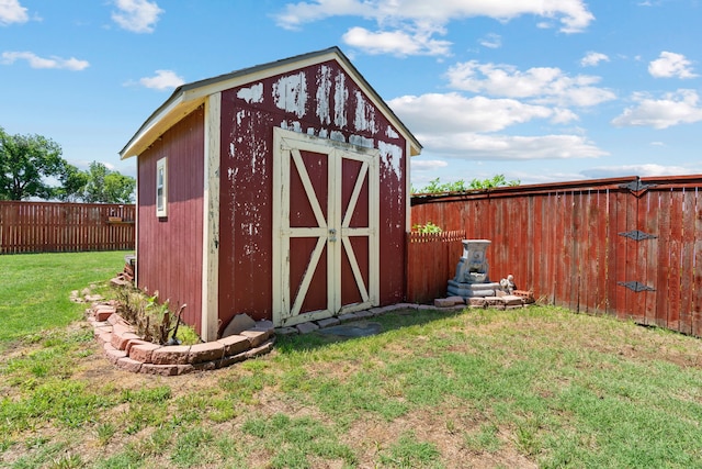 view of outdoor structure with a lawn