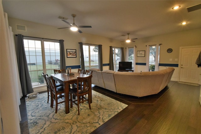 dining area featuring hardwood / wood-style floors and ceiling fan