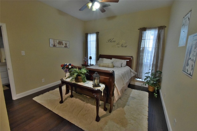 bedroom with ceiling fan and dark hardwood / wood-style floors