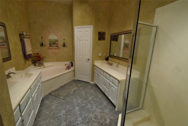 bathroom with vanity and separate shower and tub