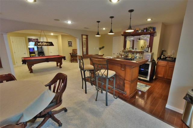 bar with pendant lighting and billiards