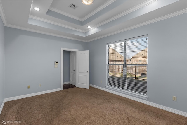 unfurnished bedroom featuring carpet floors, ornamental molding, and a raised ceiling