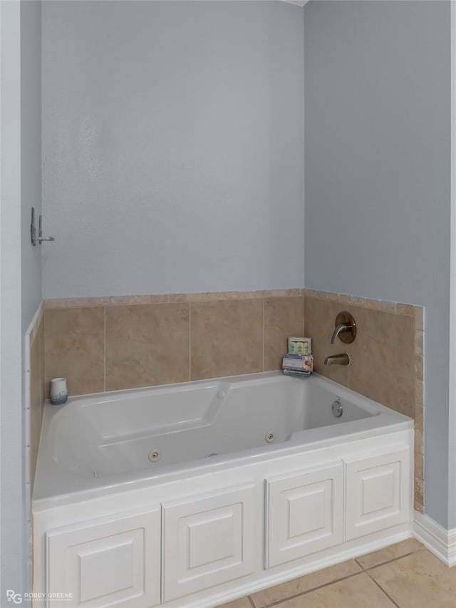 bathroom with a bathing tub and tile patterned floors