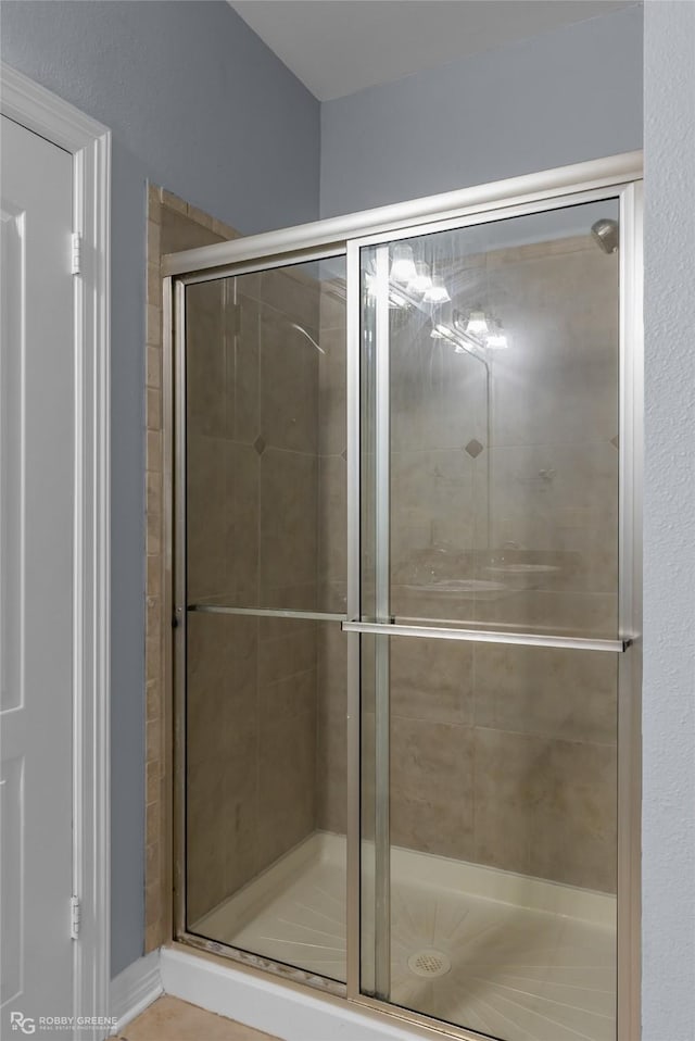 bathroom featuring an enclosed shower