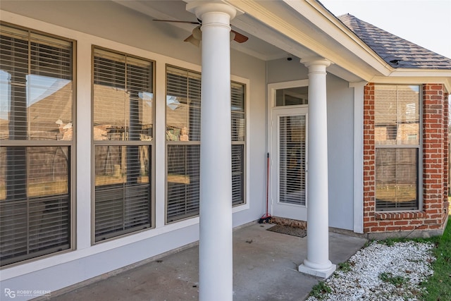 entrance to property with ceiling fan