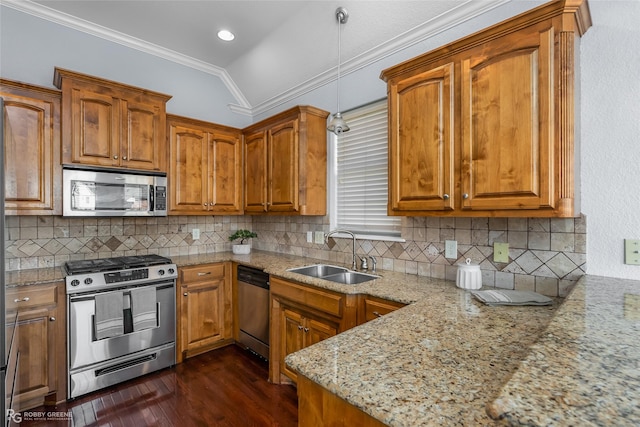 kitchen with sink, crown molding, stainless steel appliances, light stone counters, and vaulted ceiling