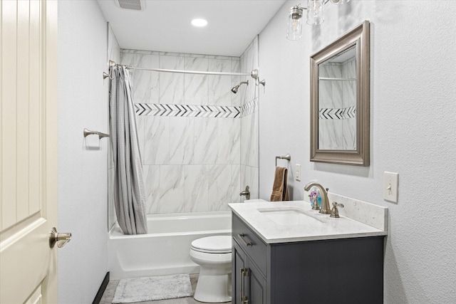 full bathroom featuring vanity, toilet, and shower / tub combo