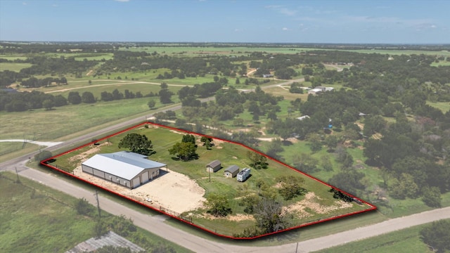 birds eye view of property featuring a rural view