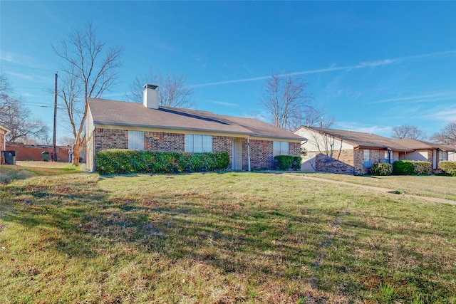 ranch-style home featuring a front yard