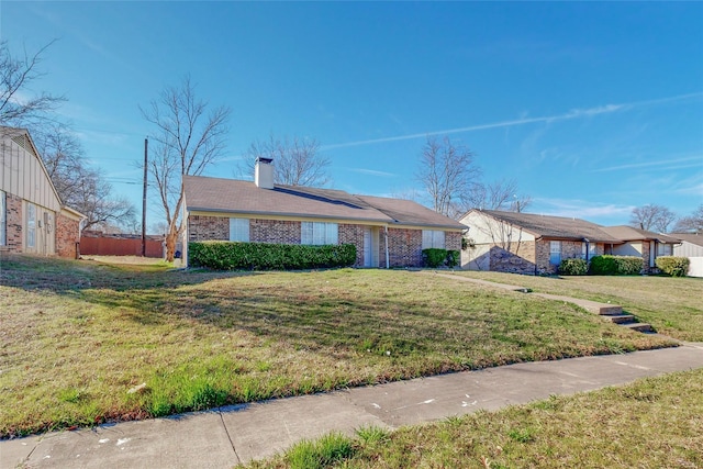 single story home featuring a front yard