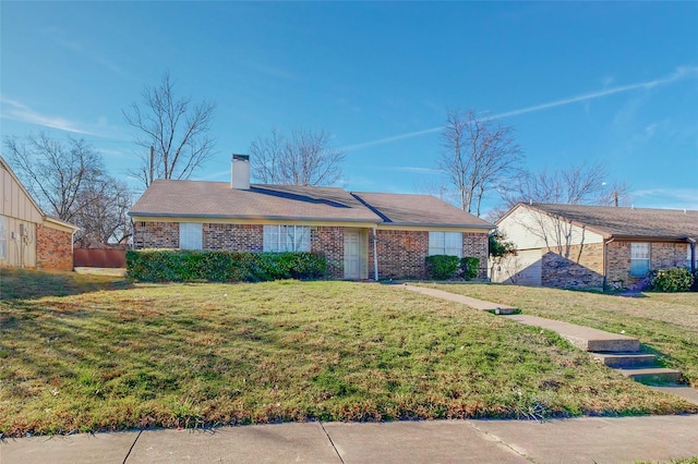 single story home with a front lawn