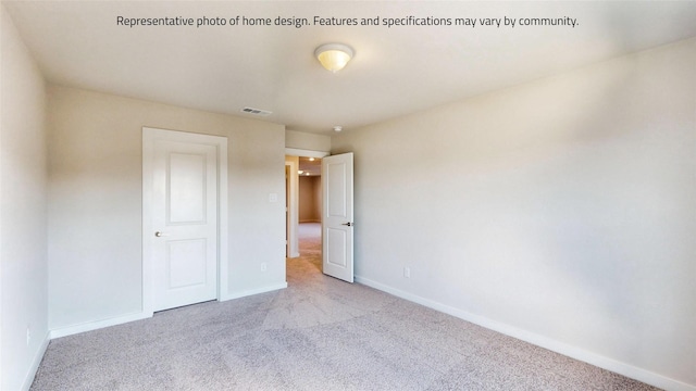 unfurnished bedroom featuring light colored carpet