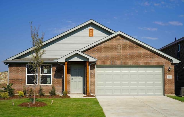 view of front of home featuring a garage and a front yard