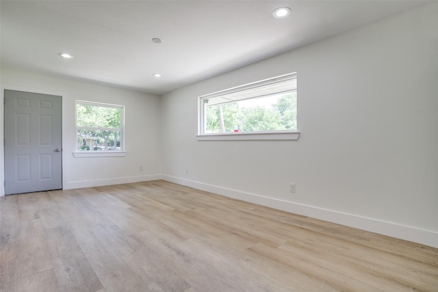 empty room with light hardwood / wood-style floors