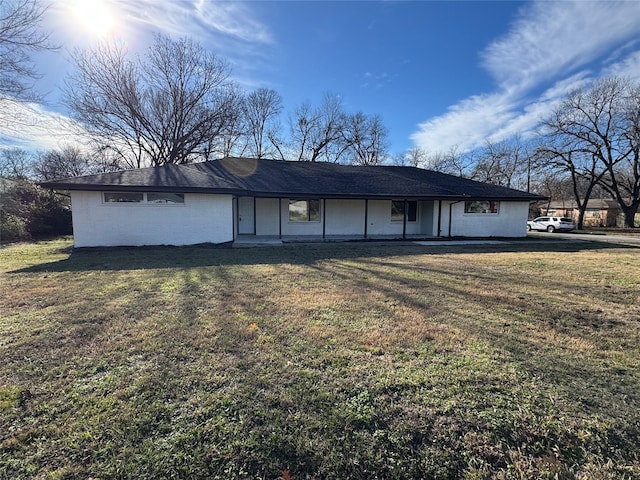 back of house with a yard