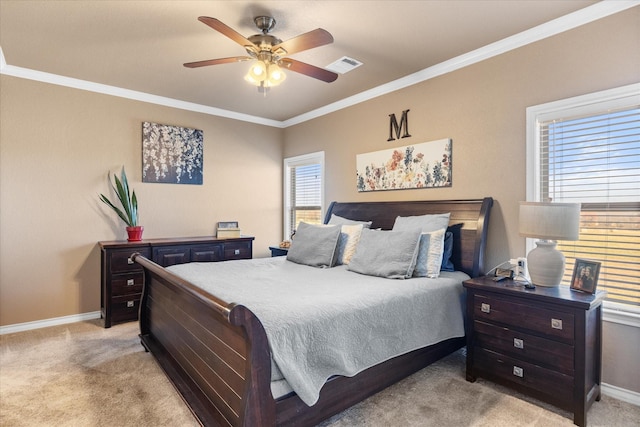 bedroom with ceiling fan, light colored carpet, and ornamental molding