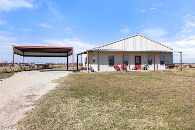 exterior space with a front yard and a carport