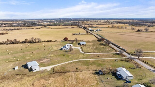 birds eye view of property featuring a rural view