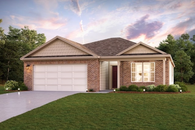 view of front of home with a lawn and a garage