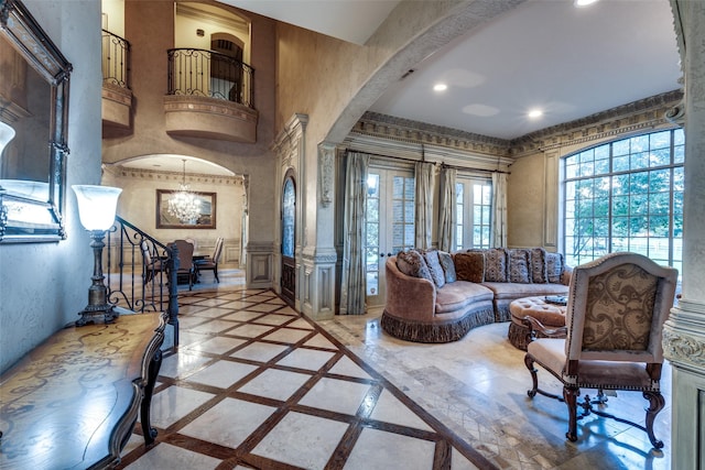 living room featuring an inviting chandelier and a towering ceiling