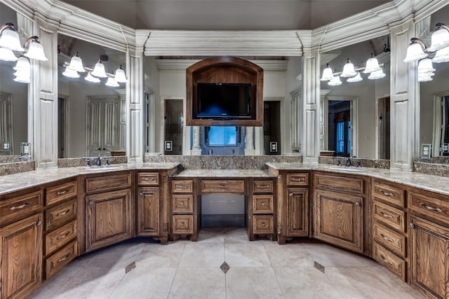 bathroom with vanity, tile patterned flooring, and ornate columns